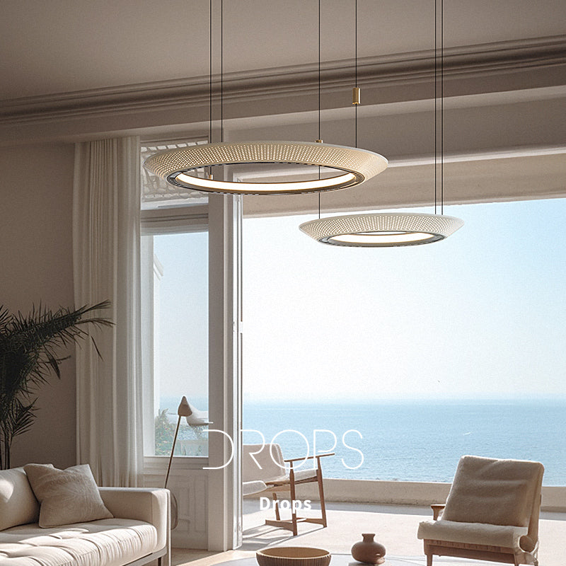 Coastal ambiance, elegant ring chandelier enhances serene spaces