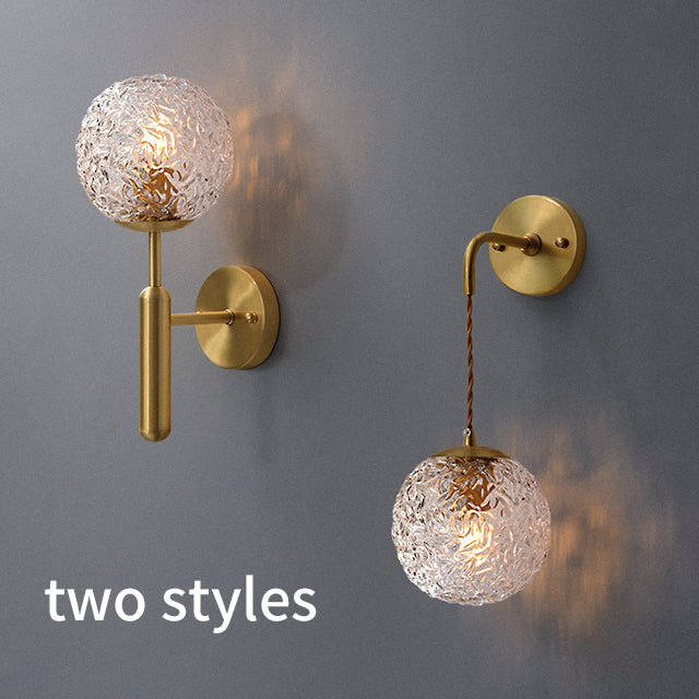 Gold and glass bulb wall lamps and chandeliers