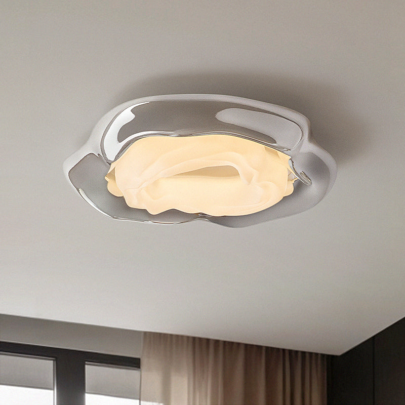 Modern wavy iron ceiling light.