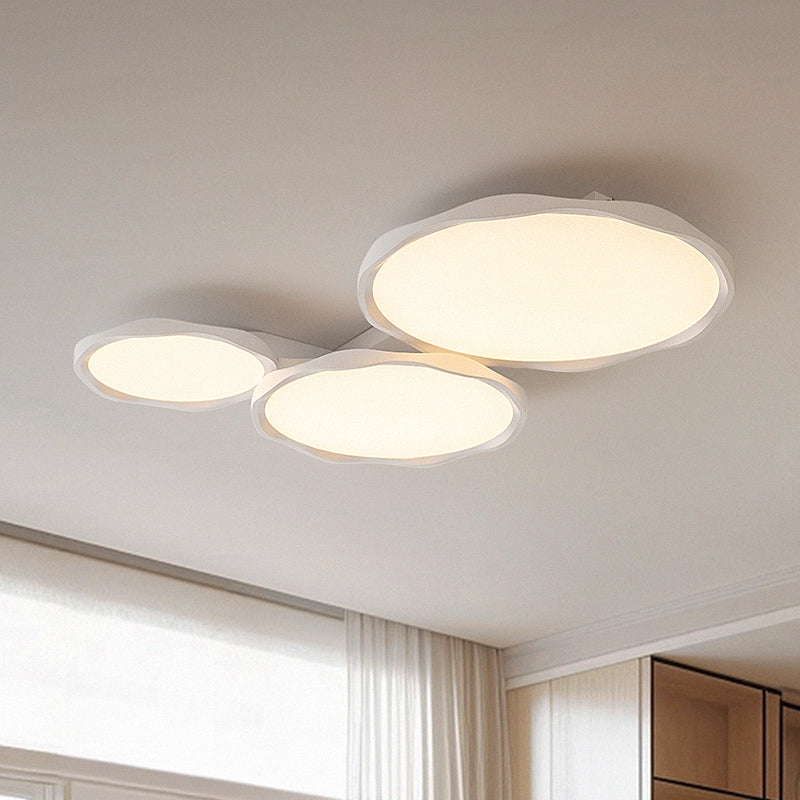 Modern tri-disc ceiling light fixture.