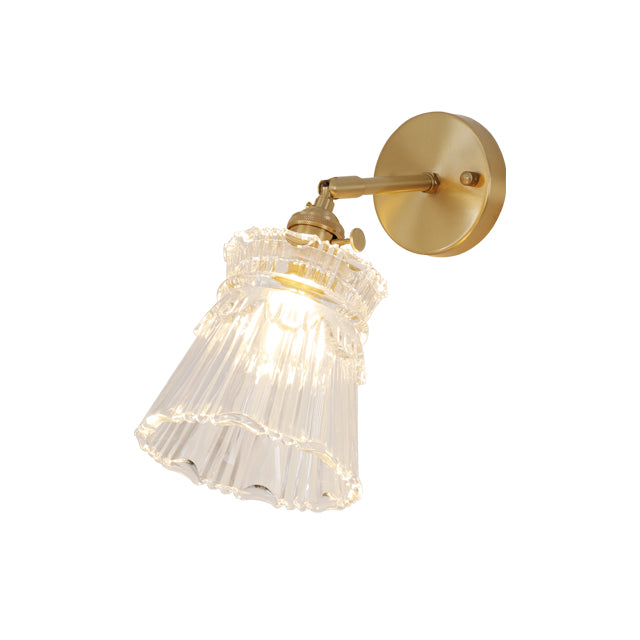 Vintage-style brass wall sconce with glass shade  white background picture